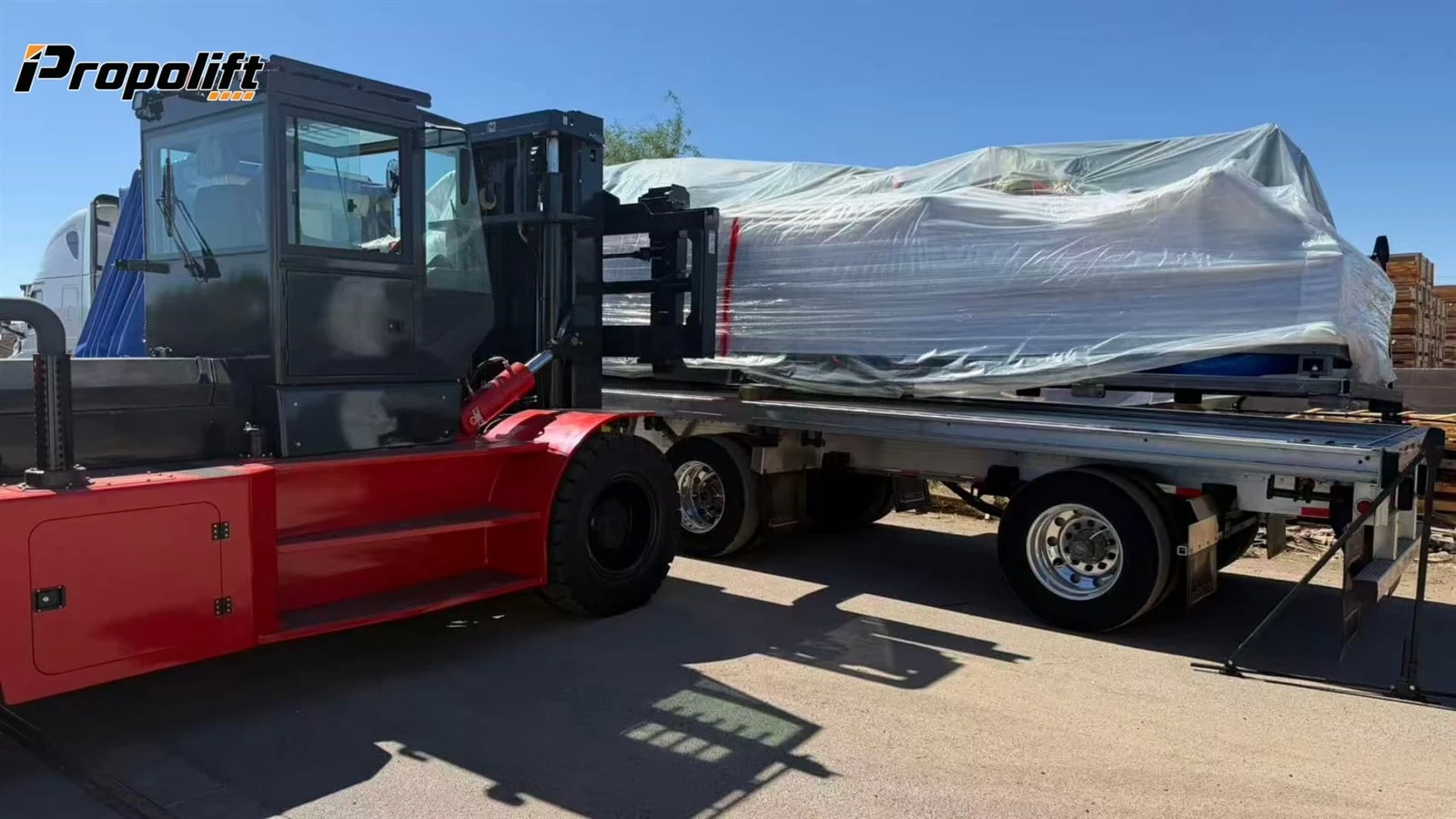 forklift with long forks handling oversized machinery forklift with long forks handling oversized machinery